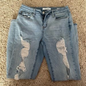 Distressed light denim skinny jeans